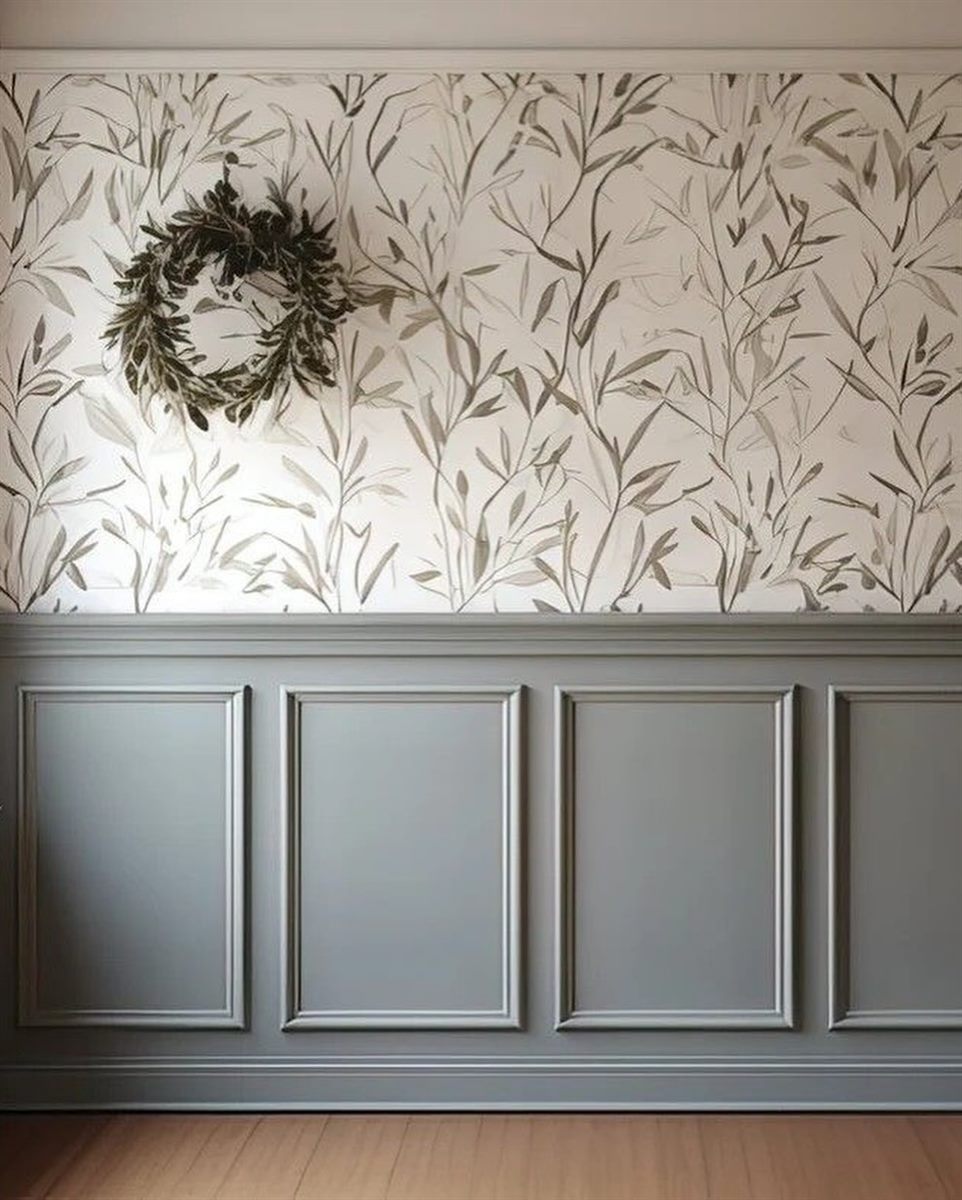 Botanical wallpaper above grey panelled wainscoting, with a eucalyptus wreath.